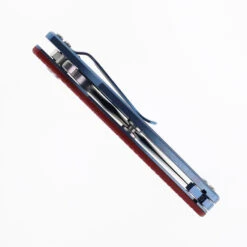 Hinderer Jurassic Slicer Folding Knife Red G10 Handle Magnacut Blue Stonewashed Titanium -Knives Store HINDERER JURASSIC MAGNACUT SLICER STONEWASH BLUE RED G10 04 38755.1747756535